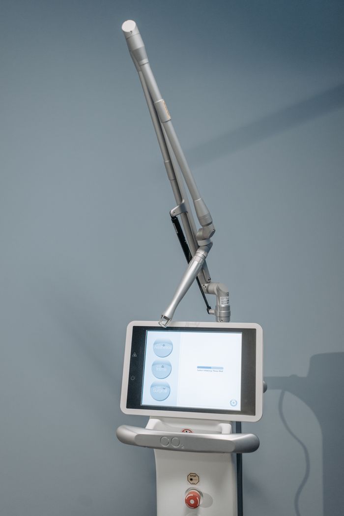 services-03 High-tech laser device used in medical procedures, featuring a digital screen, photographed indoors.